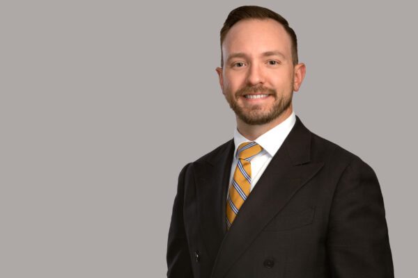 Clint M. Carlisle, Associate