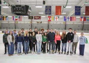 A group of associates on an ice rink.